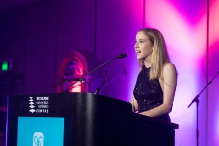 Young Adult Lady Speaking At Podium