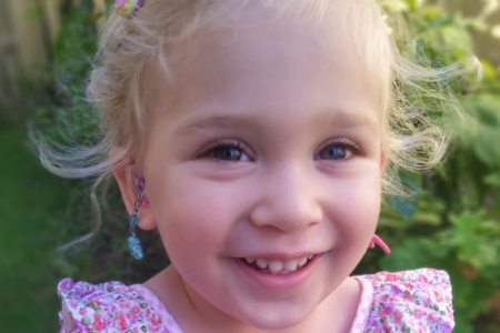 Child With Hearing Aid Earrings