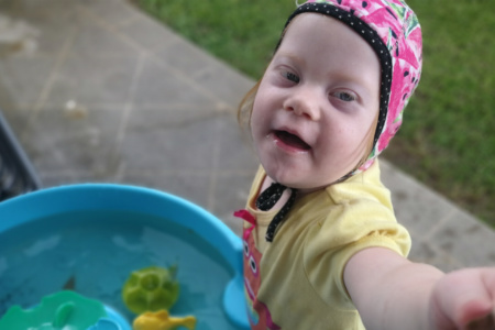 Girl Standing Beside Paddling Pool