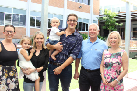 Group Of Adults And Children Smiling At Camera